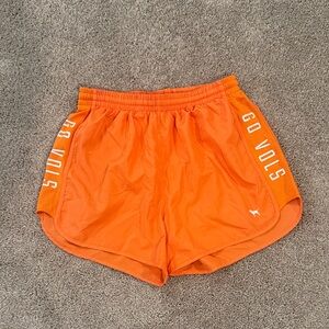 PINK Victoria's Secret Bright Orange Athletic Shorts with "GO VOLS" Side Panels